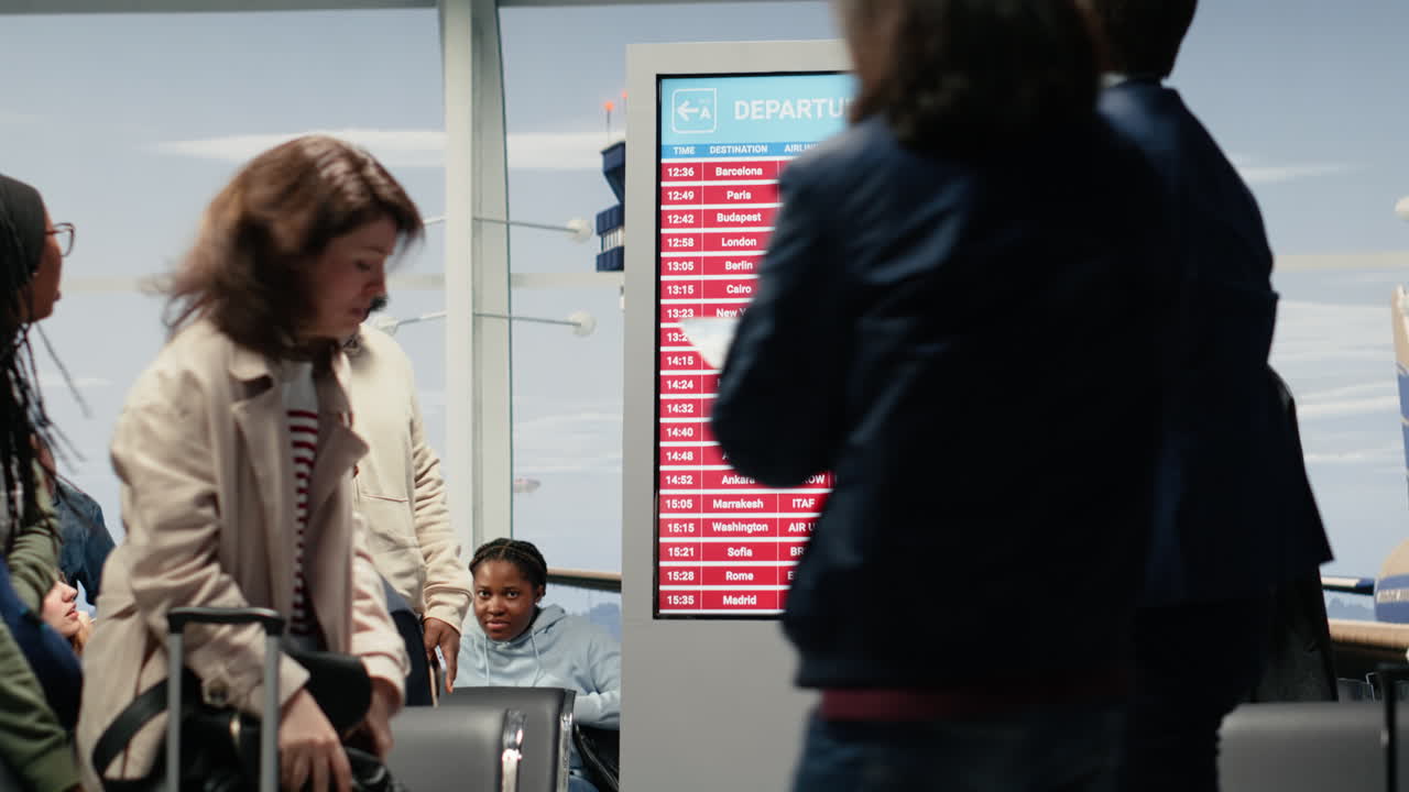 Crowd in airport waiting after global disruption delays flight