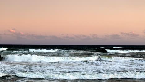 Pastel Dawn Skies Above Foamy Ocean Surf: The Quietude of Nature at Daybreak
