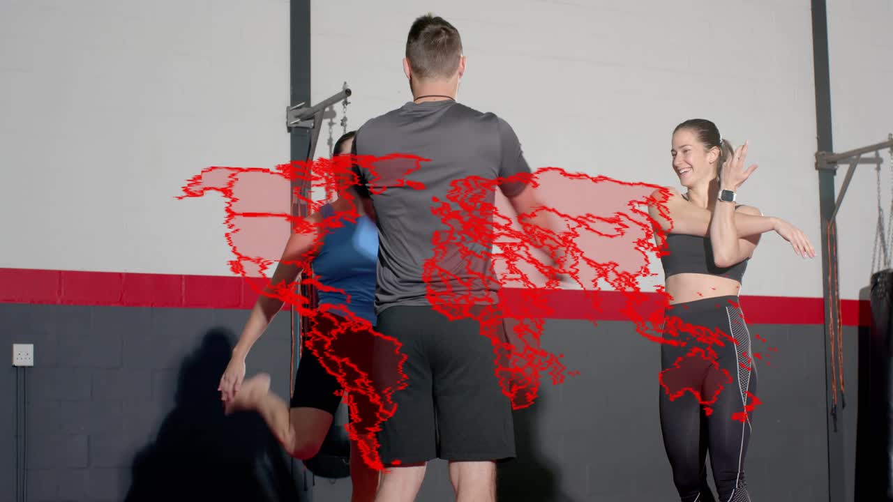 Coach demoing arm drills by bag, guiding two mirroring while red map overlay sweeping across frame