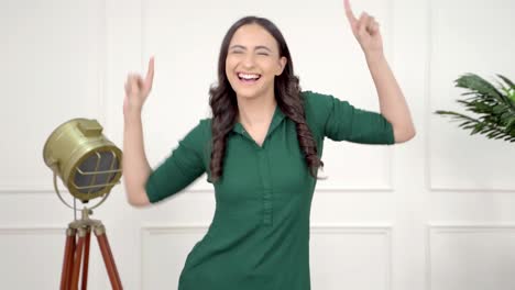 Happy-young-Indian-girl-cheering