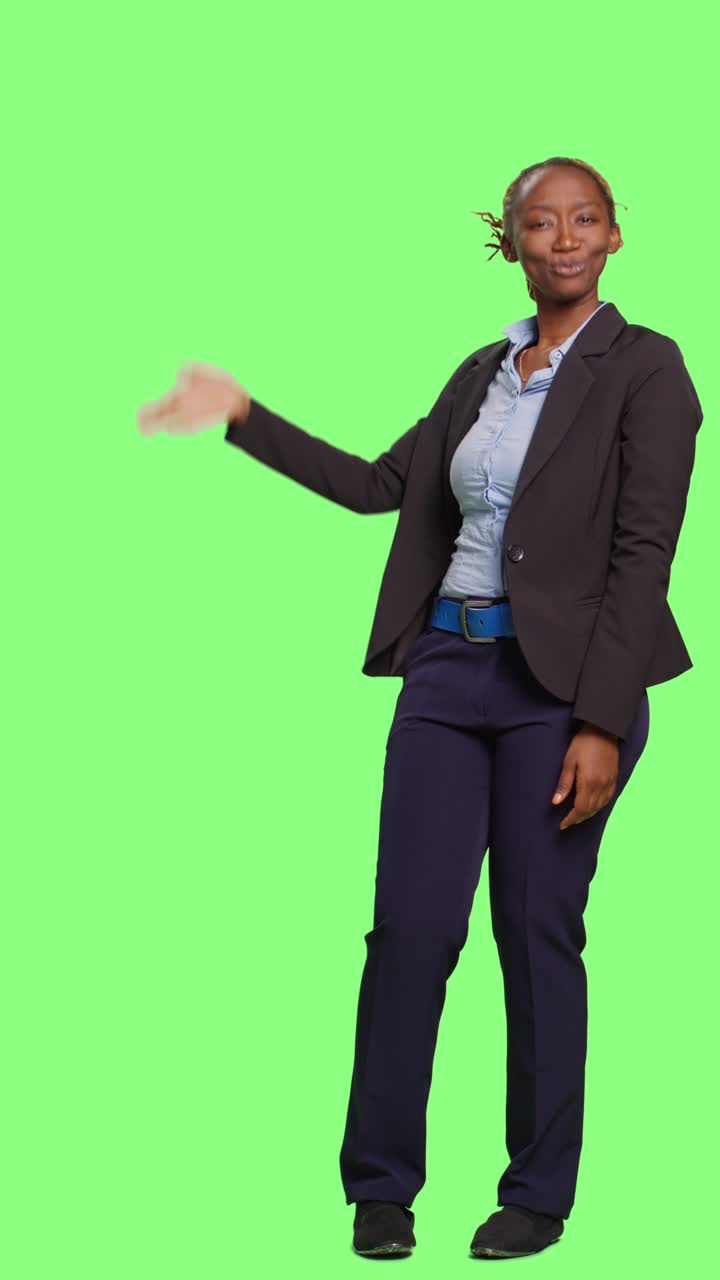 Vertical video: African american office worker doing greenscreen advertisement