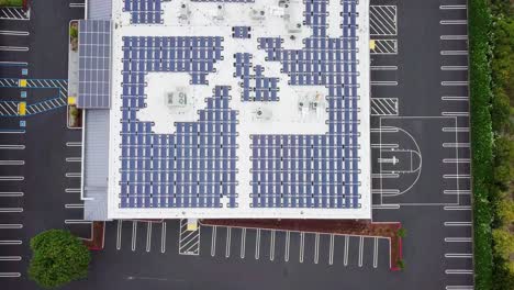 photovoltaic solar panel modules mounted on flat roof absorbing sunlight as a source of energy and generate electricity creating sustainable energy