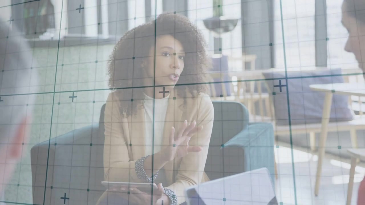 Woman tapping tablet and scrolling, gesturing through glass grid overlay, guiding business meeting