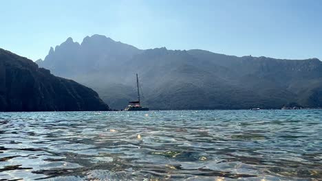 luxurious boat anchored offshore at bussaglia beach in corsica island, france