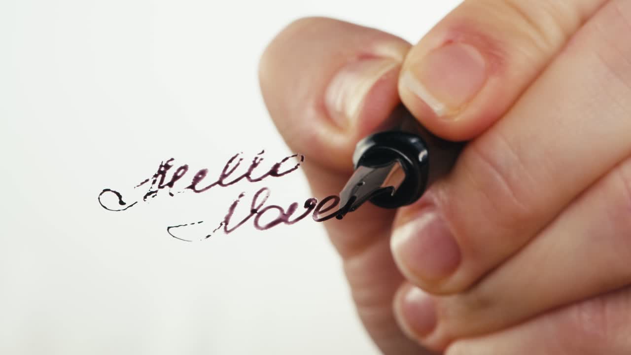 Close-up of Hand Writing "Hello November" with a Fountain Pen