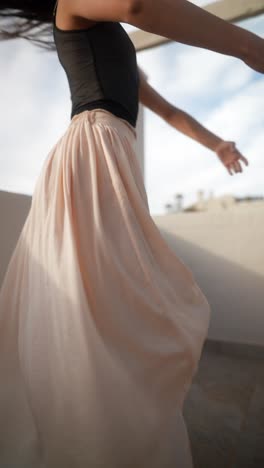 woman dancing on a balcony