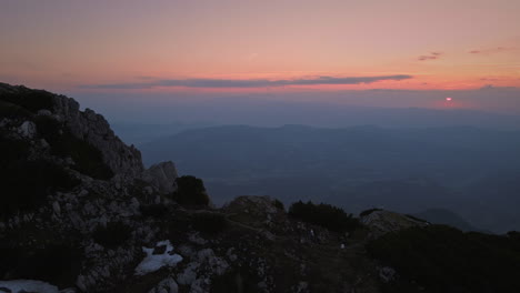 a drone shot of the top of mountain peca in the early mornig with a beautiful sunrise