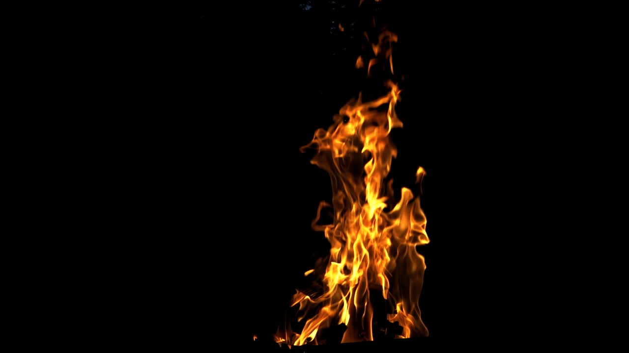 Fire flame on the black background. Fire in darkness. Slow motion