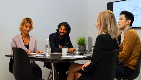 business colleagues interacting with each other in conference room 4k