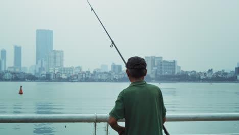 Handheld-view-of-senior-man-fishing