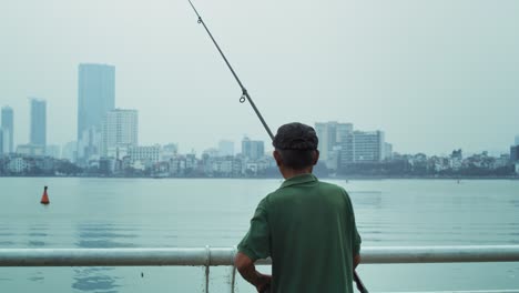 handheld view of senior man fishing