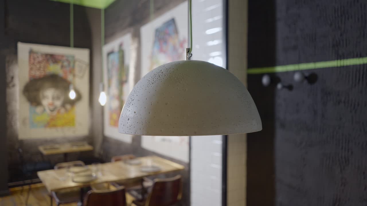 Modern Cafe Interior with Concrete Pendant Lamps and Art