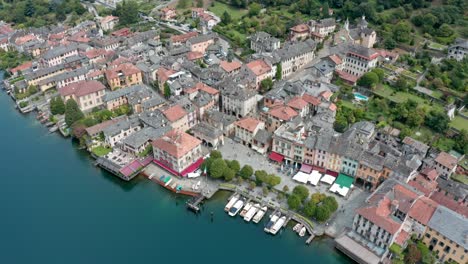 isola san giulio on lake orta, italy, showcasing historical architecture and boats, aerial view