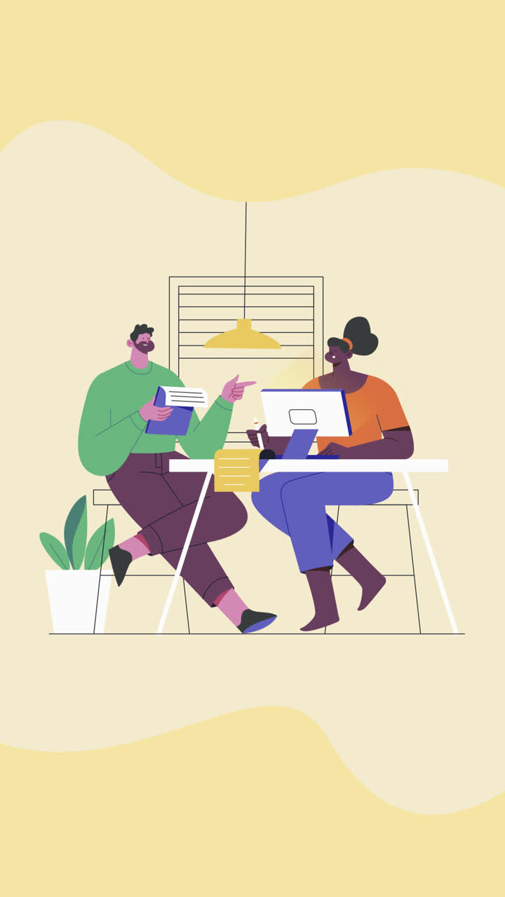 Two people collaborating at a table