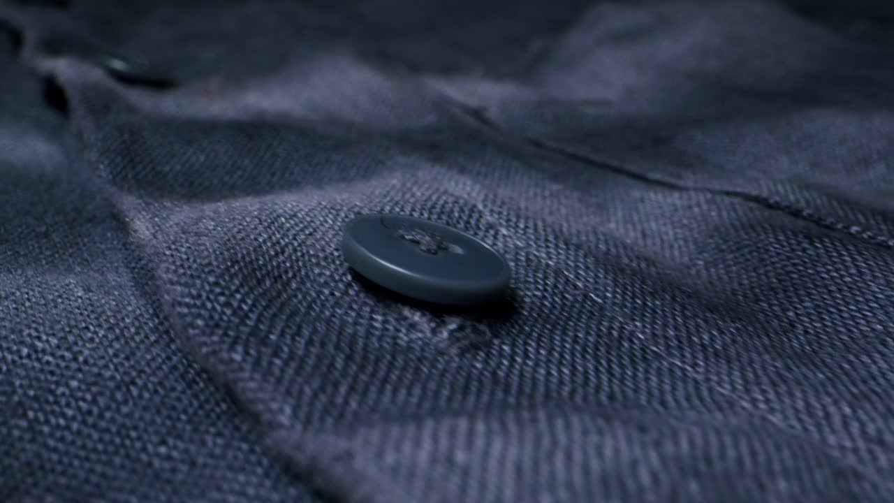 Closeup of an expertly tailored suit that beautifully showcases its sophisticated buttons and fine fabric texture