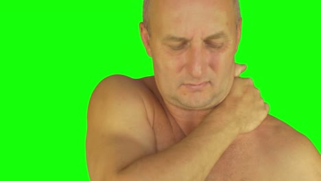 extreme close up shot of man rubbing his neck and shoulders.