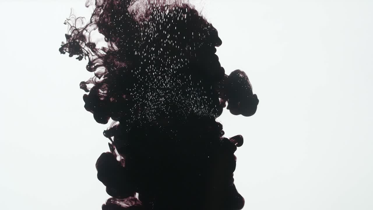 Black Ink Drop Into Water On A White Background