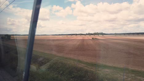 Static-Shot-Taken-from-the-Inside-of-The-TGV,-The-Famous-French-Fast-Train-During-Sunny-Day,-France