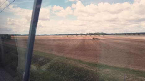 static shot taken from the inside of the tgv, the famous french fast train during sunny day, france