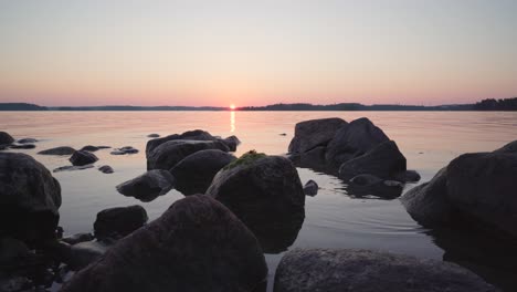 rocks in the sea during the sunset