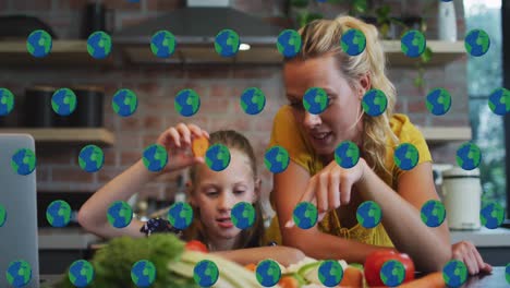 animación de iconos del globo sobre madre y hija caucásicas en la cocina