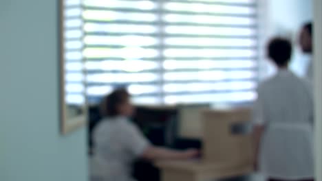 busy hospital reception with doctors and receptionists