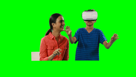 Smiling-mother-assisting-son-in-using-virtual-reality-headset-4k