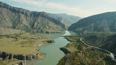aerial view of a river flowing through a mountain valley