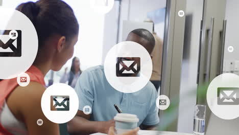 animation of envelope icons data processing over diverse business people in office