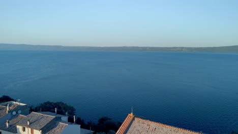 capo di monte old village on the promontory surrounded by the bolsena lake at sunset