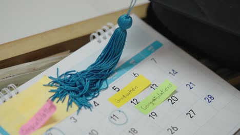 graduation cap on a paper calendar countdown planning for graduation day