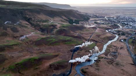 aerial view of steaming boreholes and hot springs on outskirts of hveragerdi, south iceland