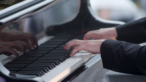 pianist playing a grand piano