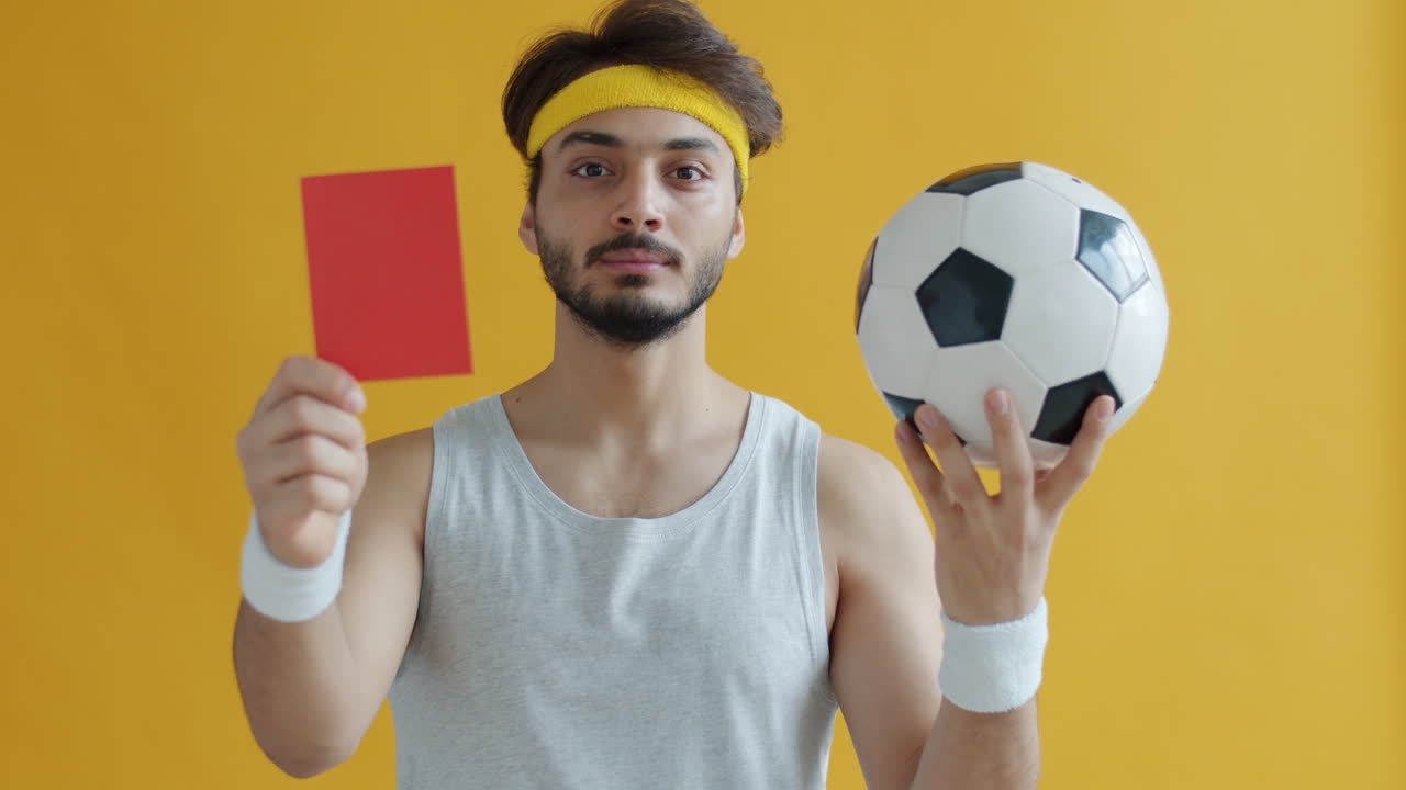Soccer Player Receiving a Red Card