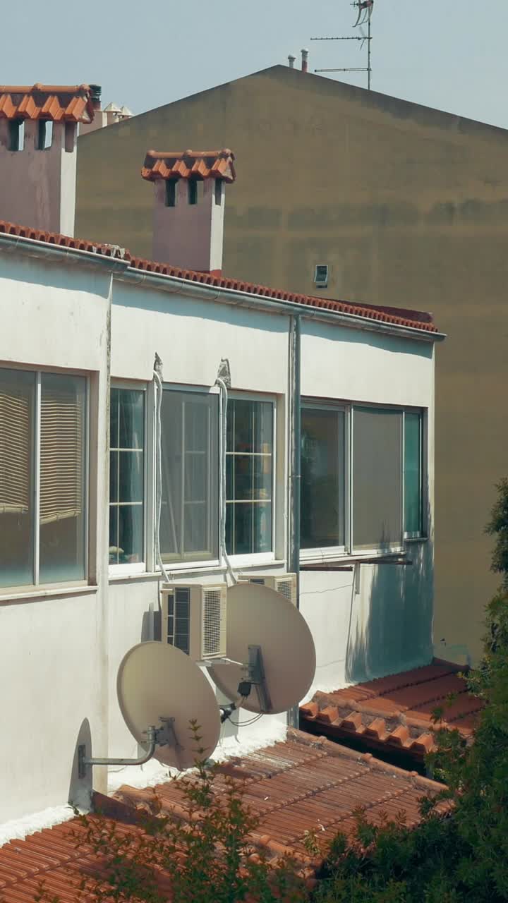 Building with Satellite Dishes and Windows
