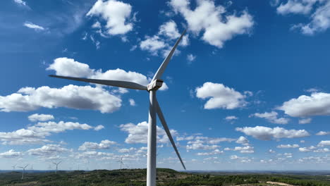 Close-up-of-wind-turbine-blades-rotating-with-blue