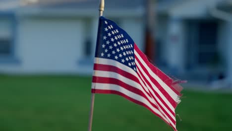Close-up-American-flag-waving-in-orbiting-shot,-Slow-Motion
