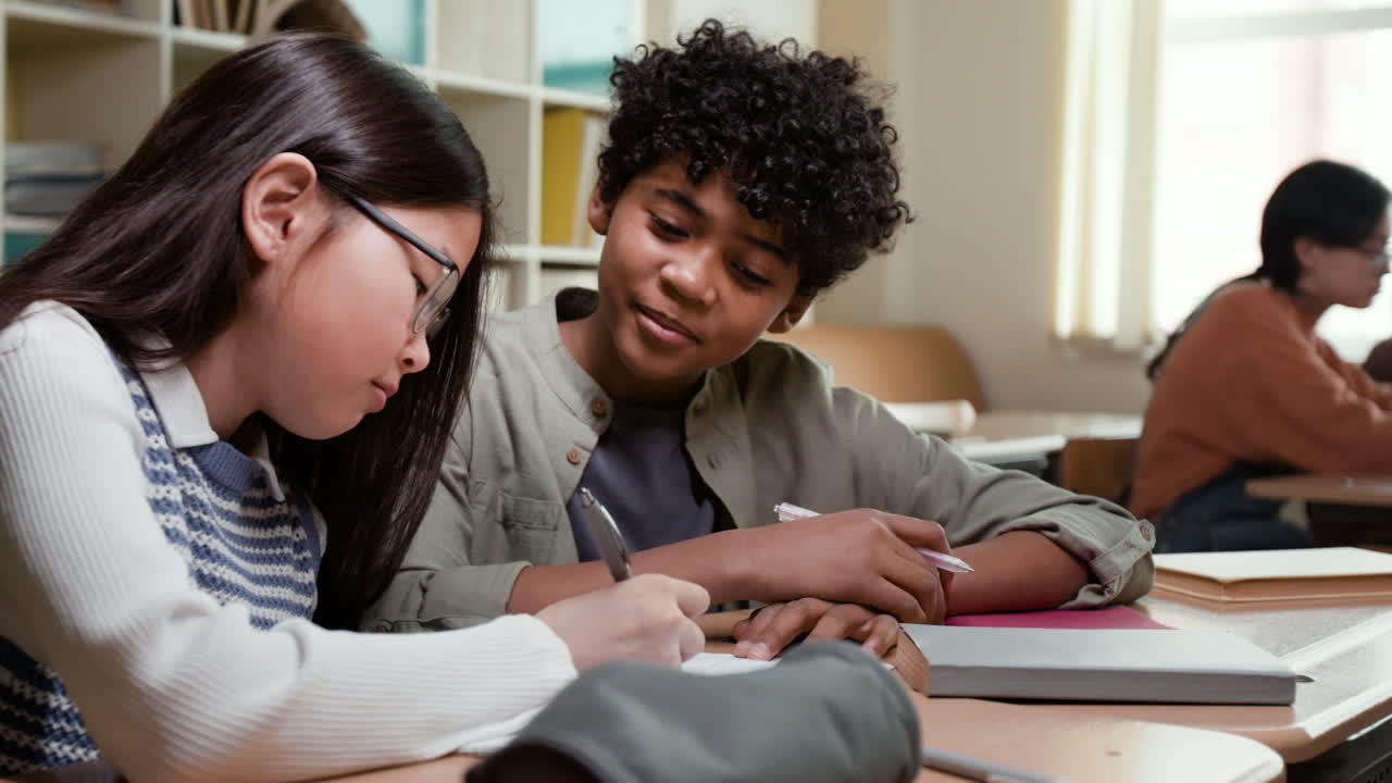 Diverse students collaborating and studying together in a classroom
