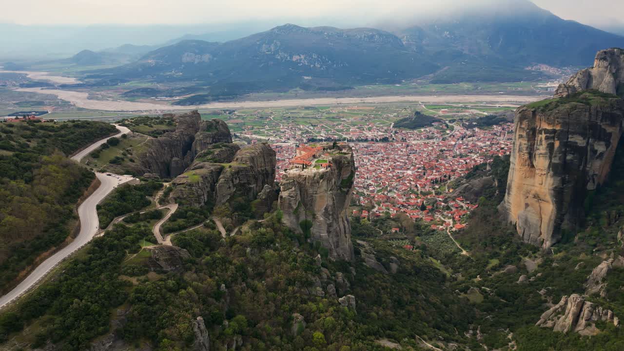 Cinematic drone orbit around Great Meteoron Monastery on peak in Meteora, Greece