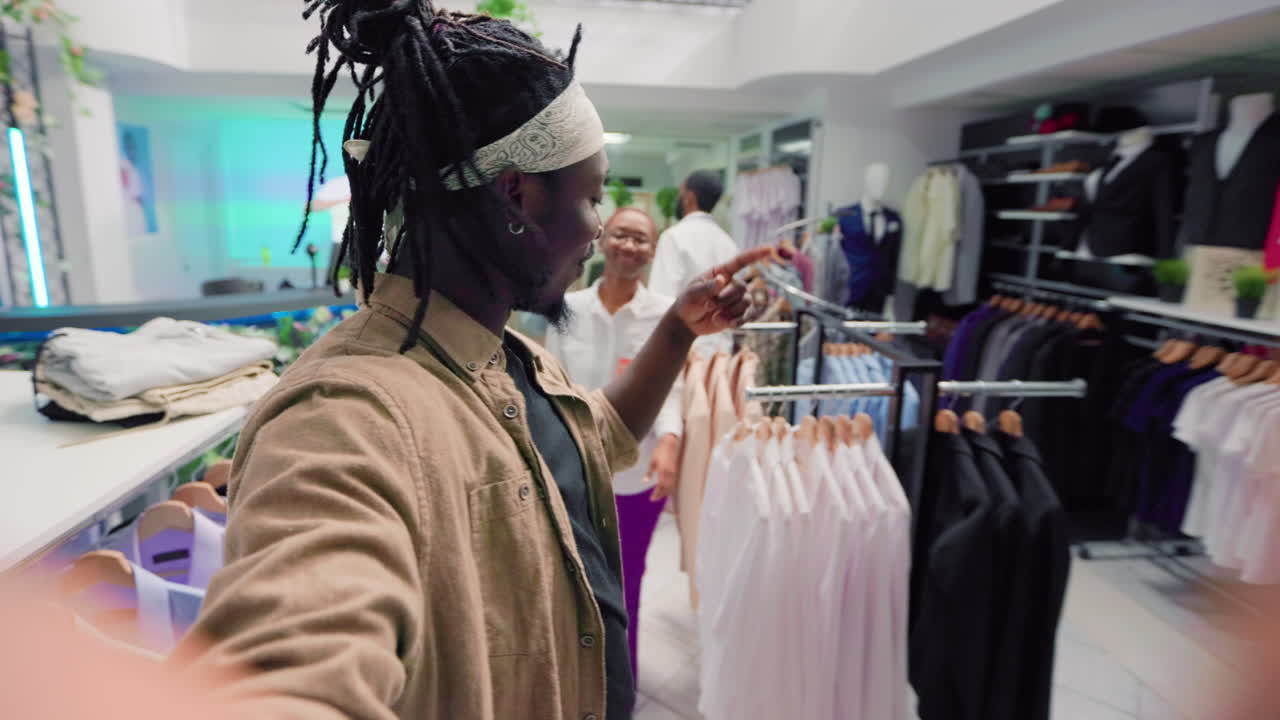 Man films POV content in clothing store
