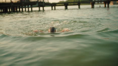 kid diving in water slow motion video