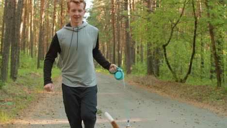 man running with dog in forest