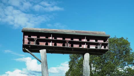 pigeon house against blue cloudy sky - close up