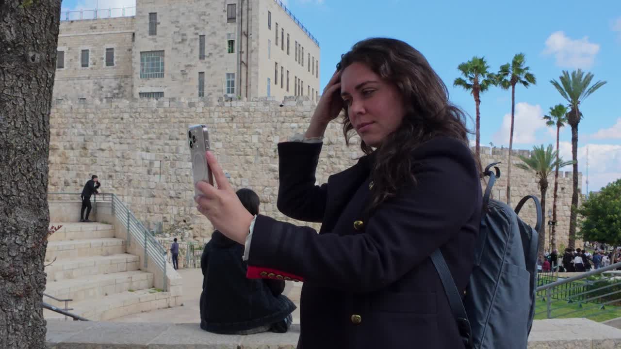 Woman Taking Selfie at Famous Jerusalem Landmark