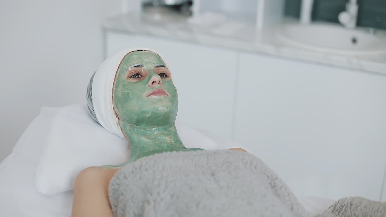 Woman Receiving a Facial Mask Treatment