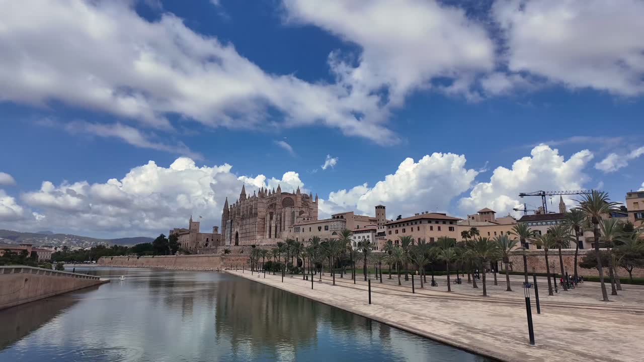 A timelapse of Palma de Mallorca Historical Centre and Cathedral, Under a Blue Sky with Some Clouds