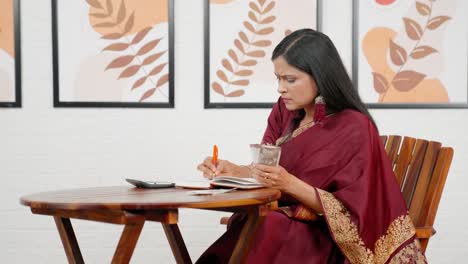 indian woman managing money and budgeting