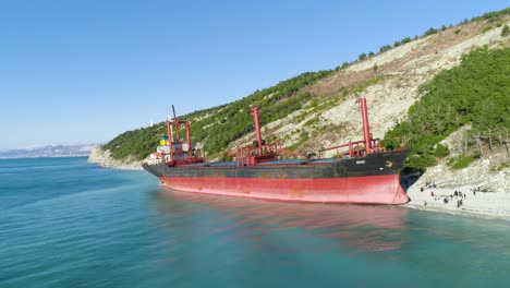 abandoned cargo ship on a coastal beach