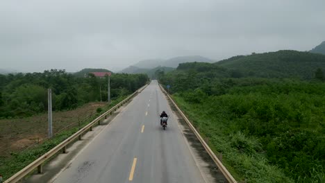 country road with motorcyclist