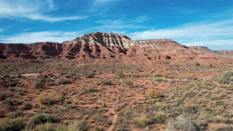 southwest usa desert with eroded red rock cliffs -utah drone 4k